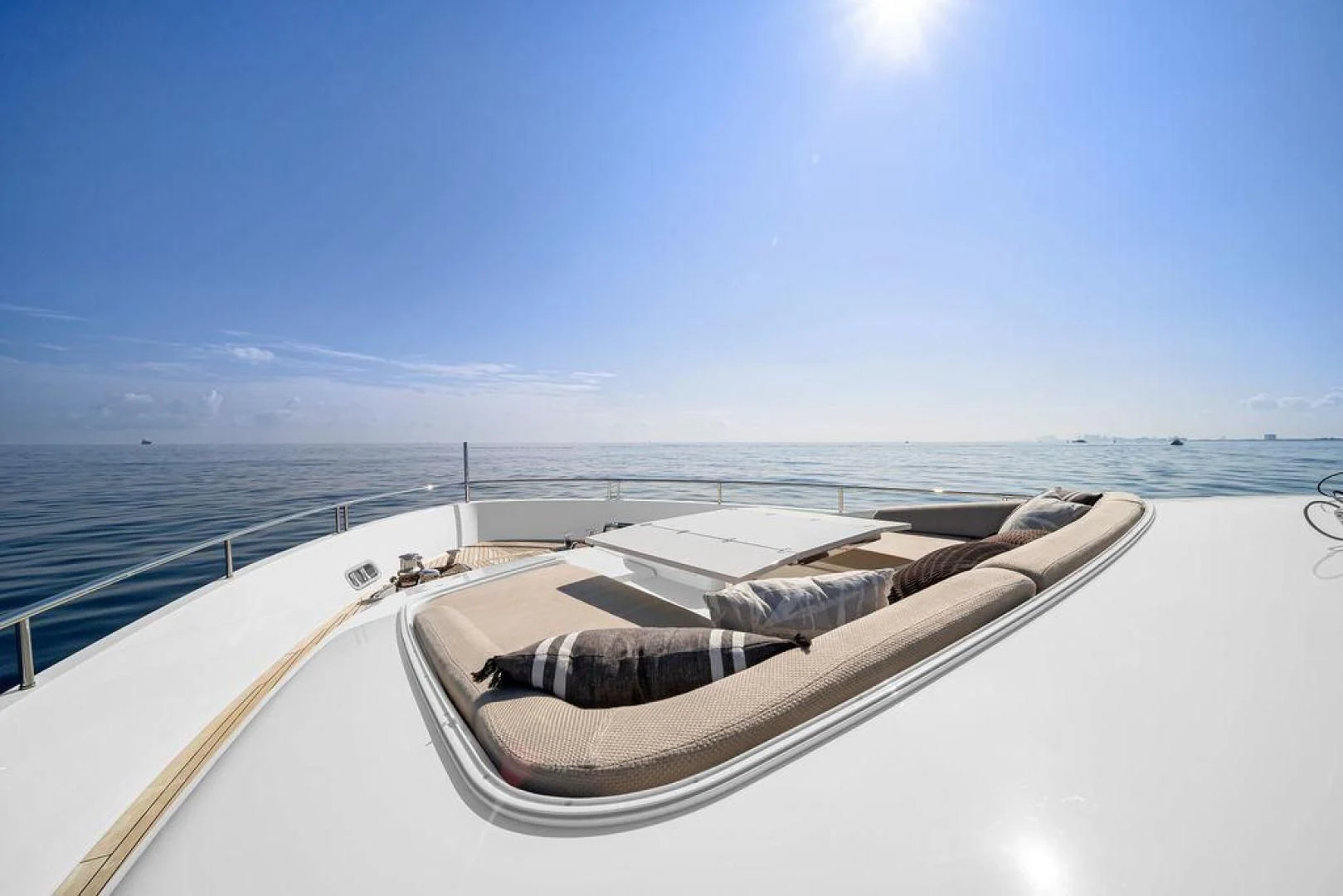 a large white boat on a large body of water aboard JUJU Yacht for Sale