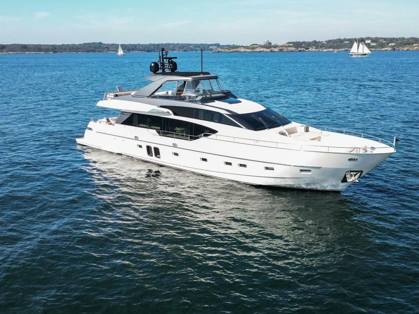 a white yacht in the water aboard JUJU Yacht for Sale