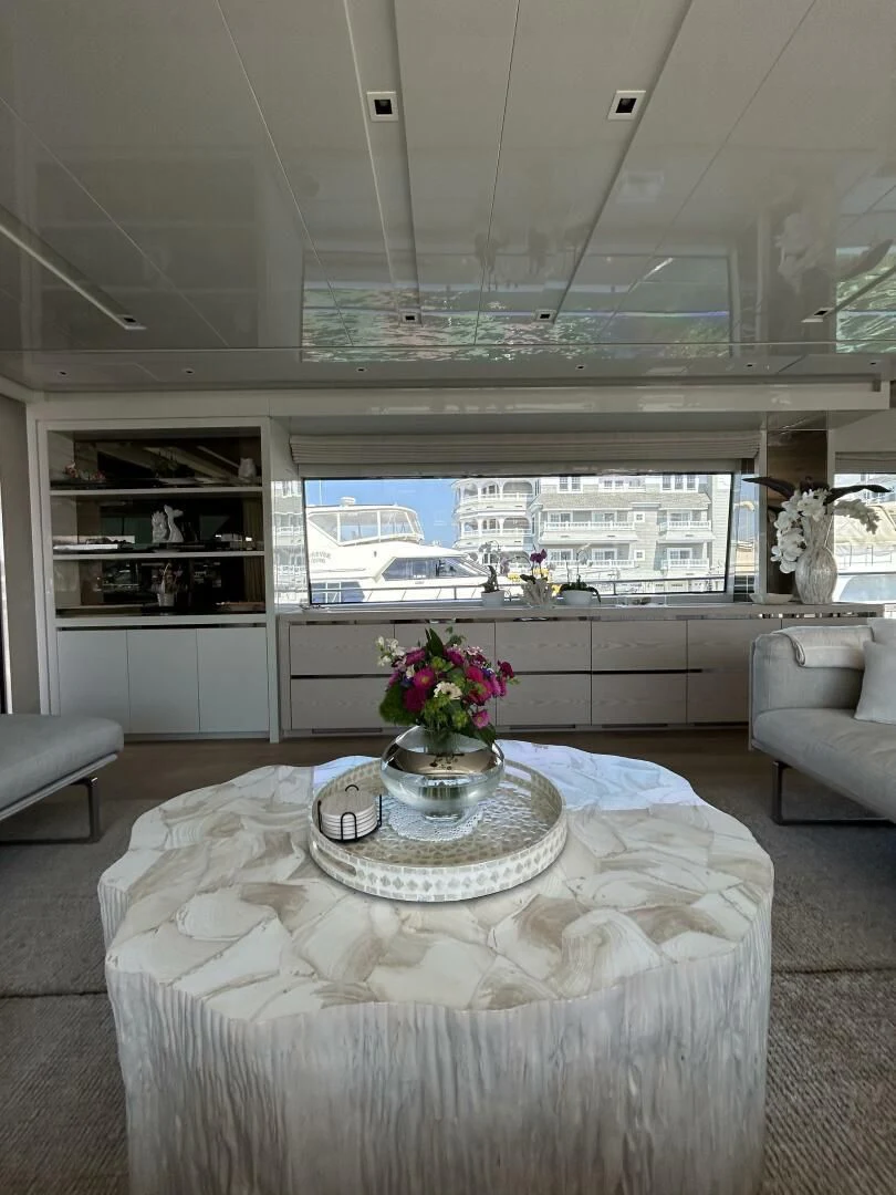 a room with a table and chairs aboard JUJU Yacht for Sale
