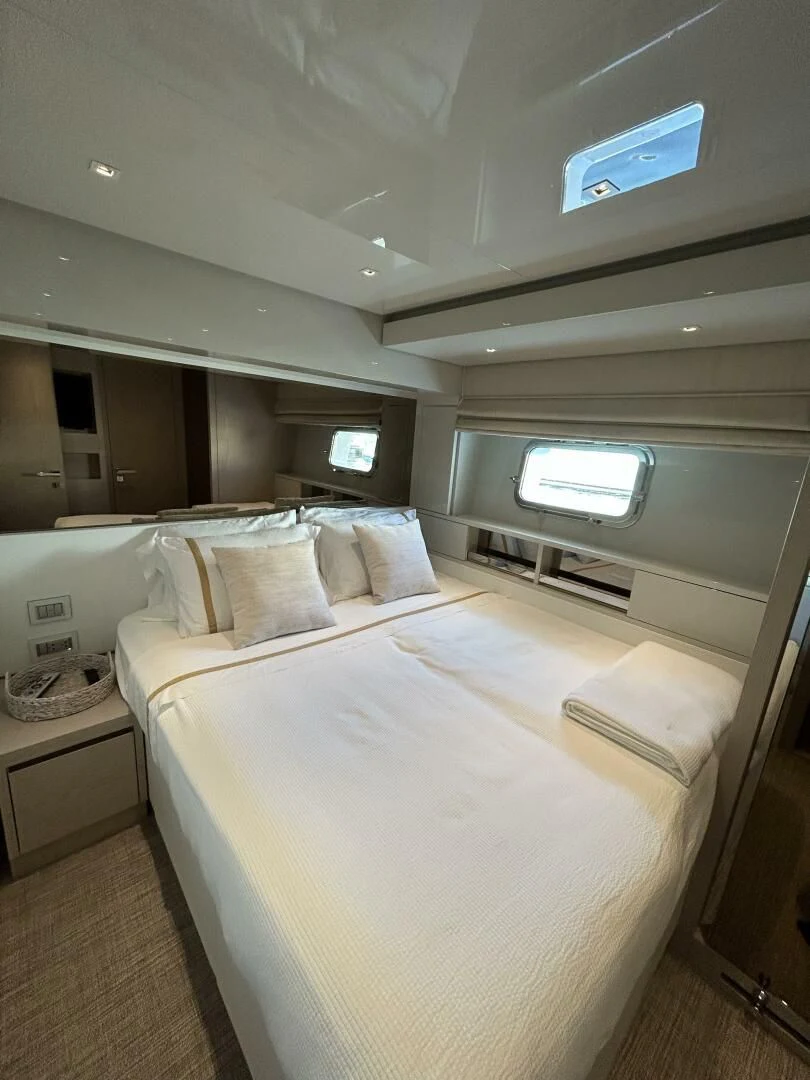 a bed in a room aboard JUJU Yacht for Sale