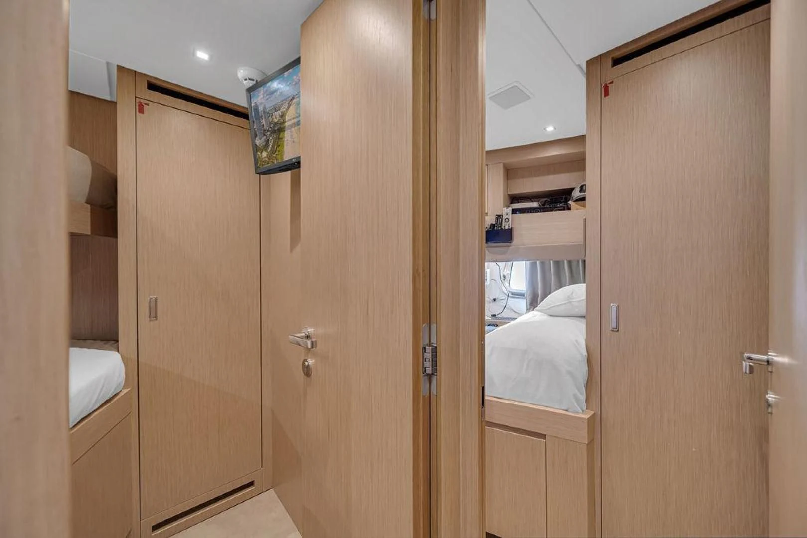 a room with wooden doors aboard JUJU Yacht for Sale
