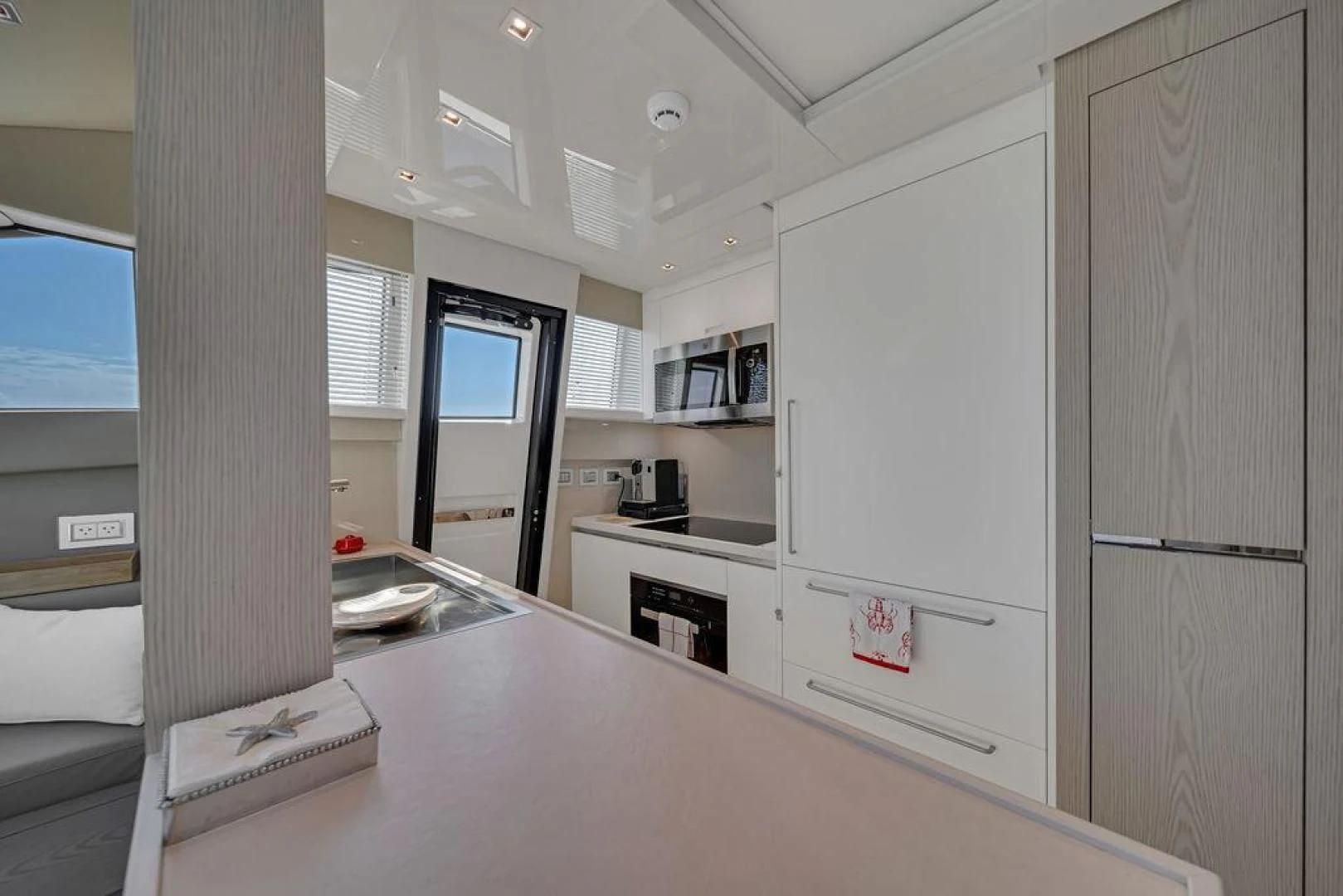 a room with a desk and a computer aboard JUJU Yacht for Sale