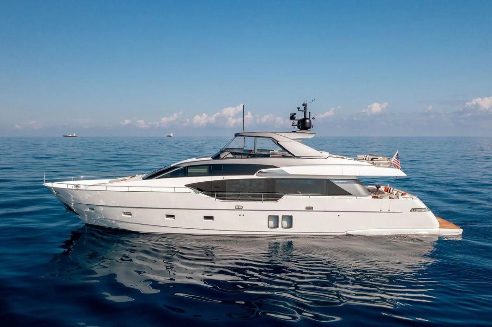 a white yacht in the water aboard JUJU Yacht for Sale