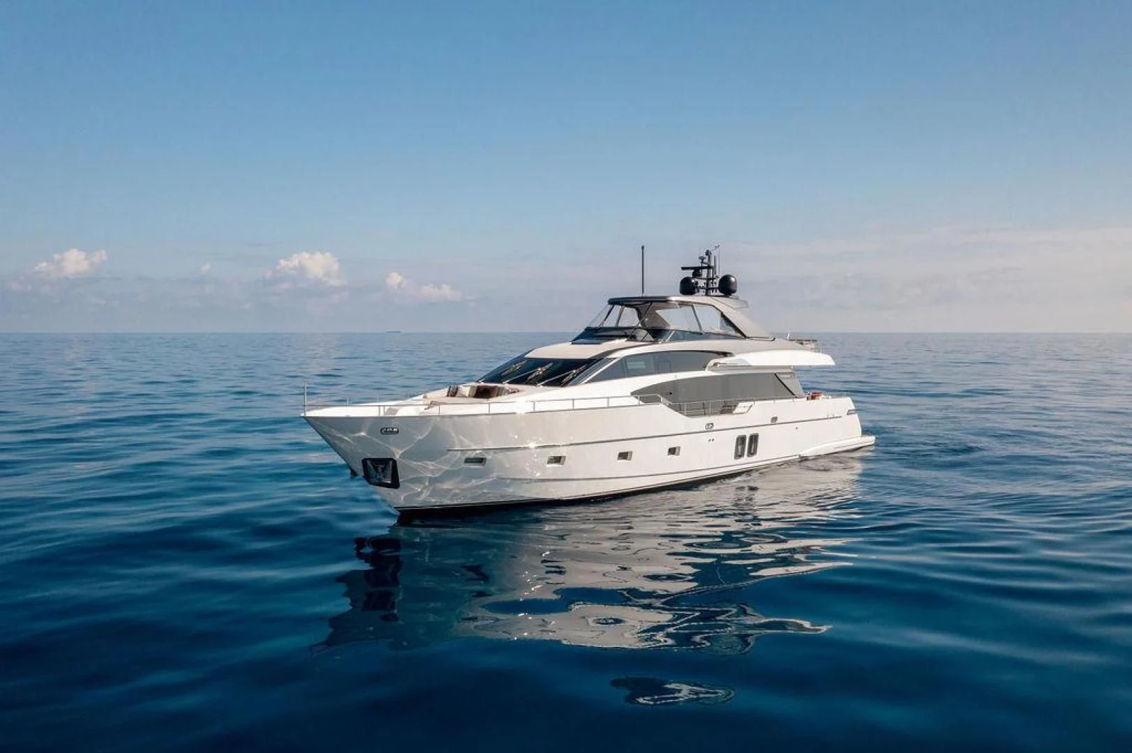 a white yacht in the water aboard JUJU Yacht for Sale