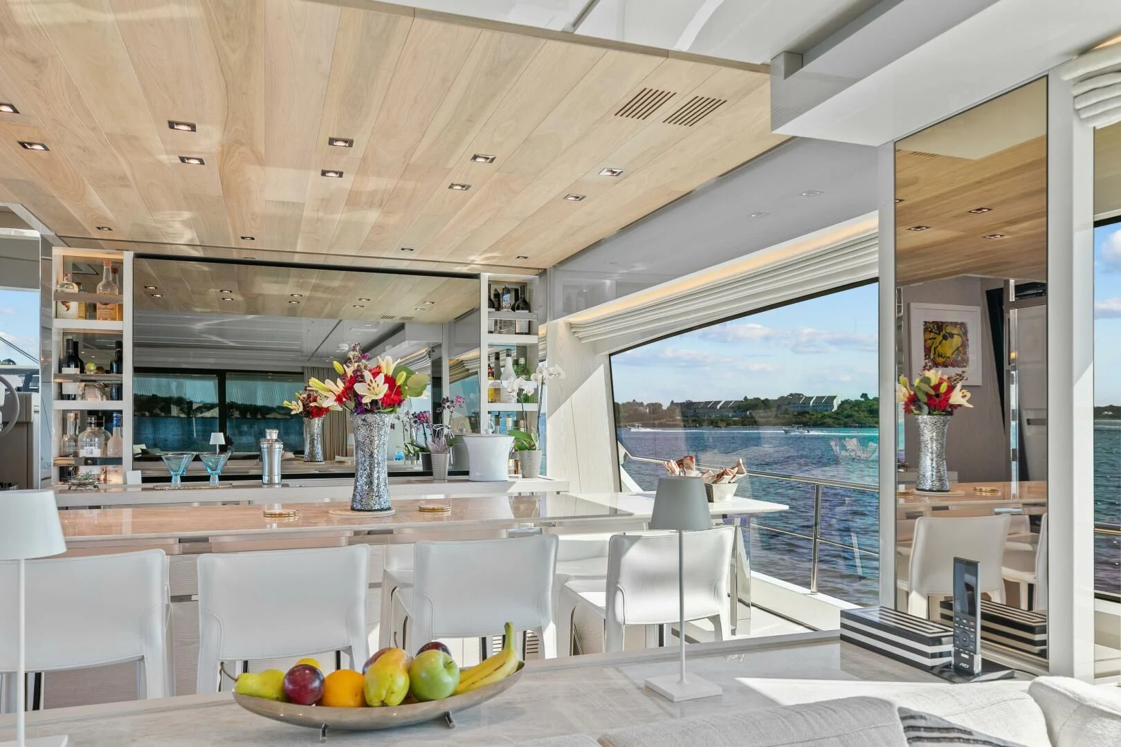 a room with a table and chairs aboard JUJU Yacht for Sale