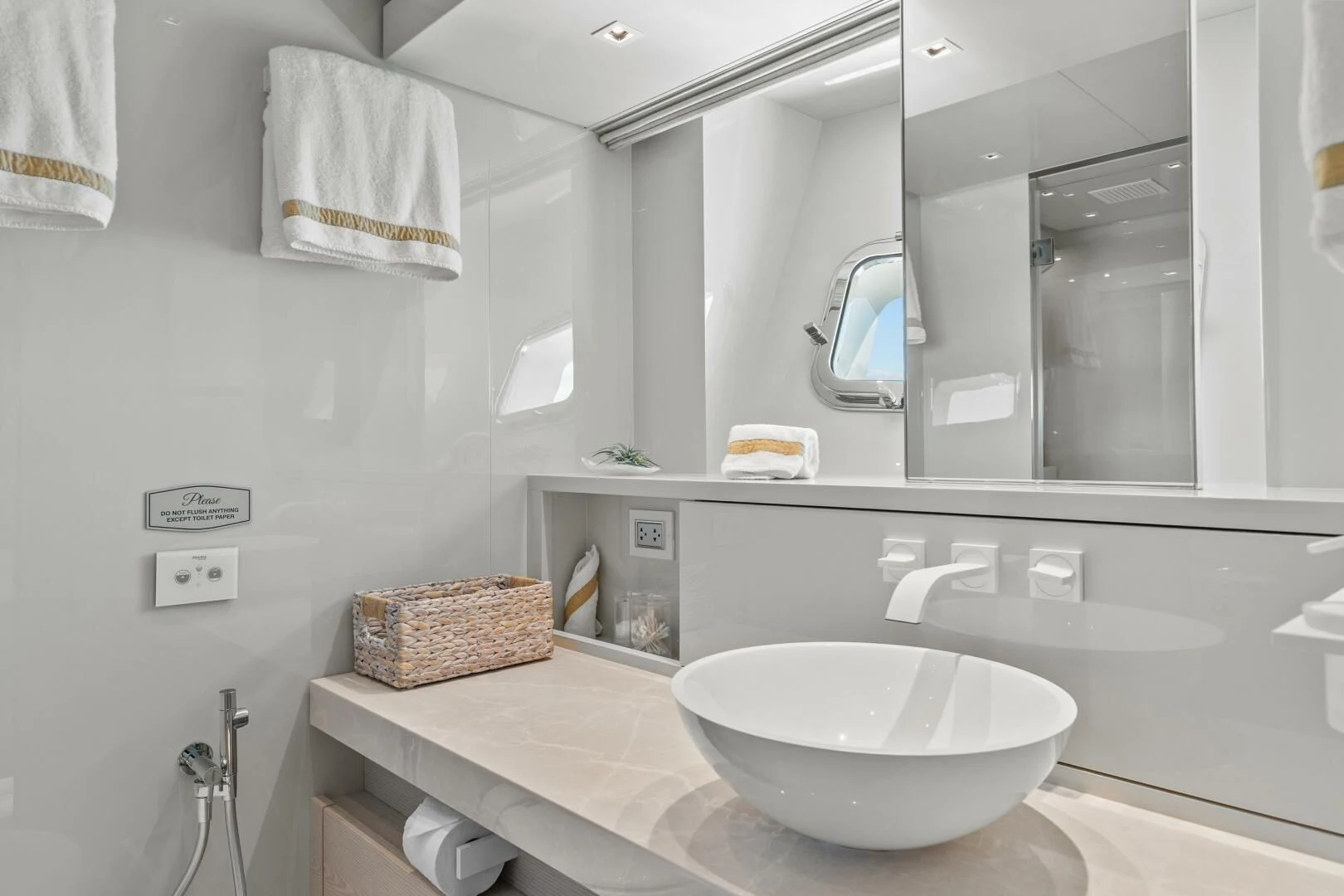 a bathroom with a sink and a large mirror aboard JUJU Yacht for Sale