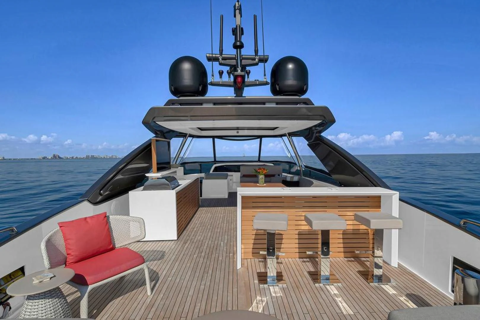 a deck with a table and chairs on it aboard JUJU Yacht for Sale
