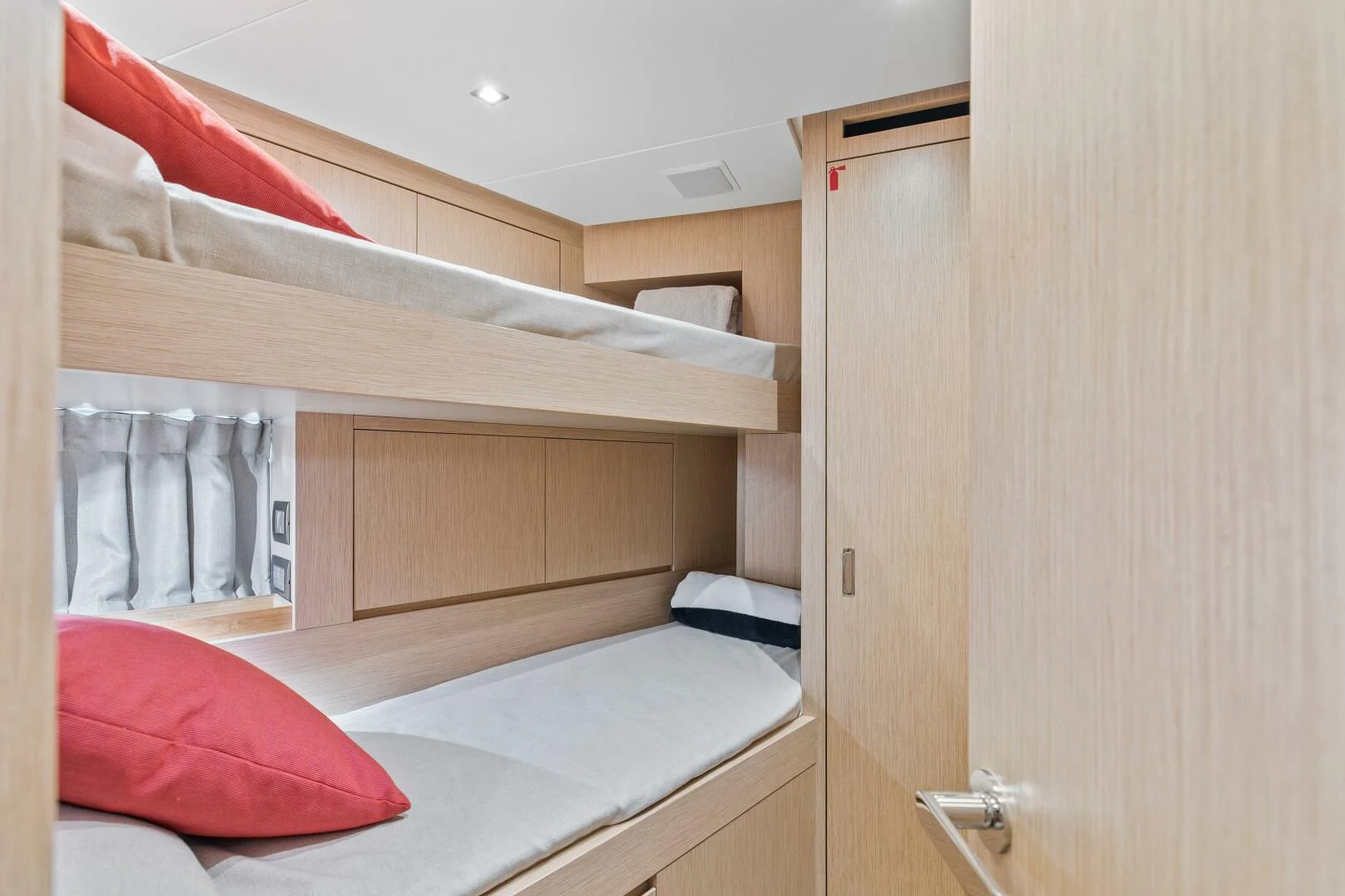 a closet with a bed and a closet aboard JUJU Yacht for Sale