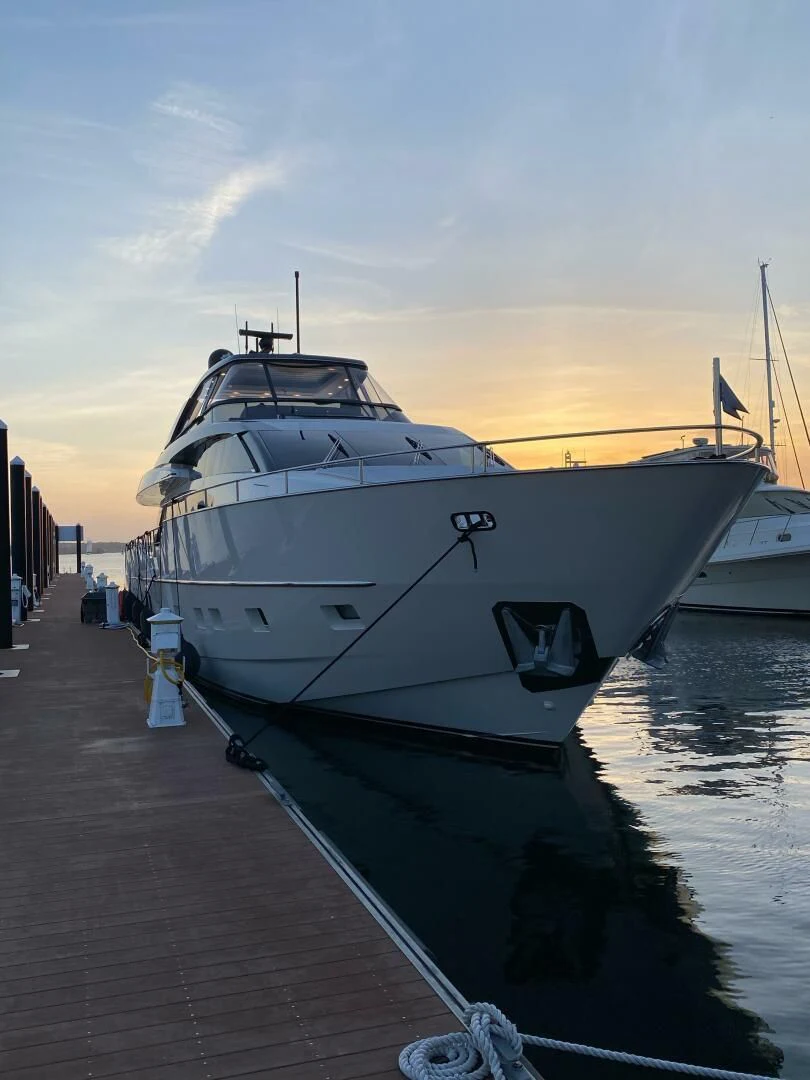 a boat docked at a pier aboard JUJU Yacht for Sale
