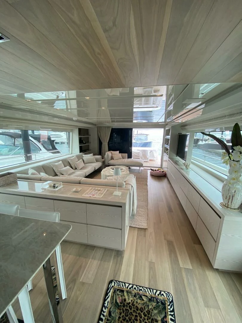 a living room with a large window aboard JUJU Yacht for Sale