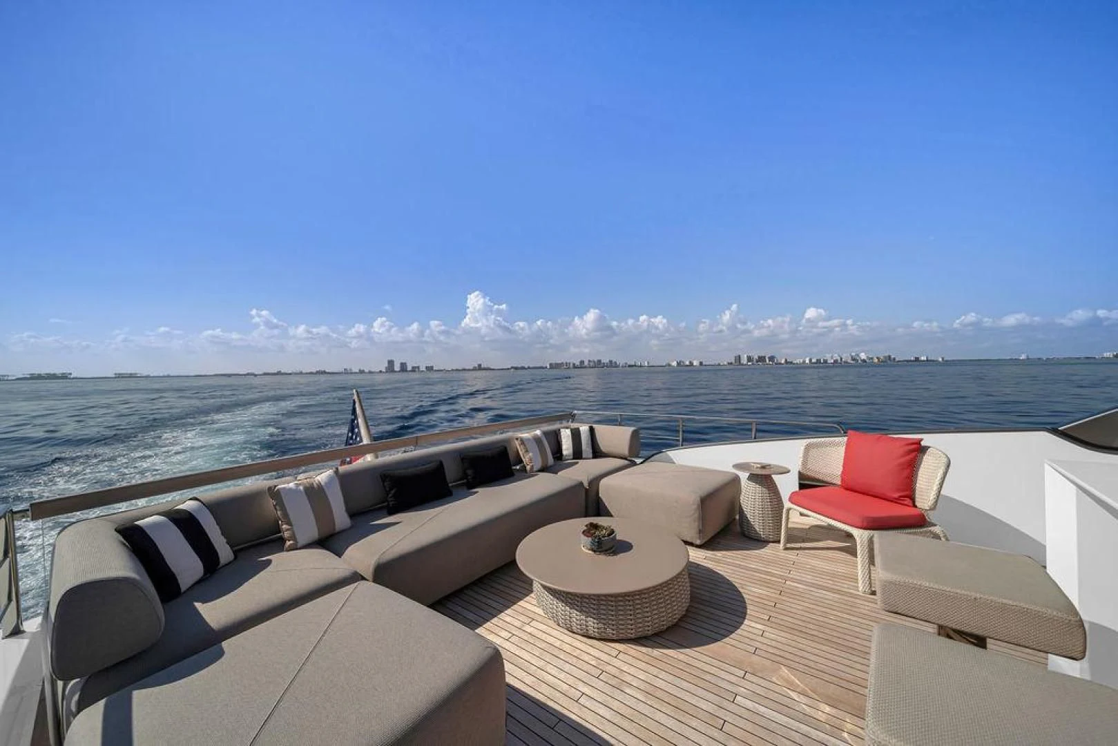 a room with a view of the ocean and a beach aboard JUJU Yacht for Sale