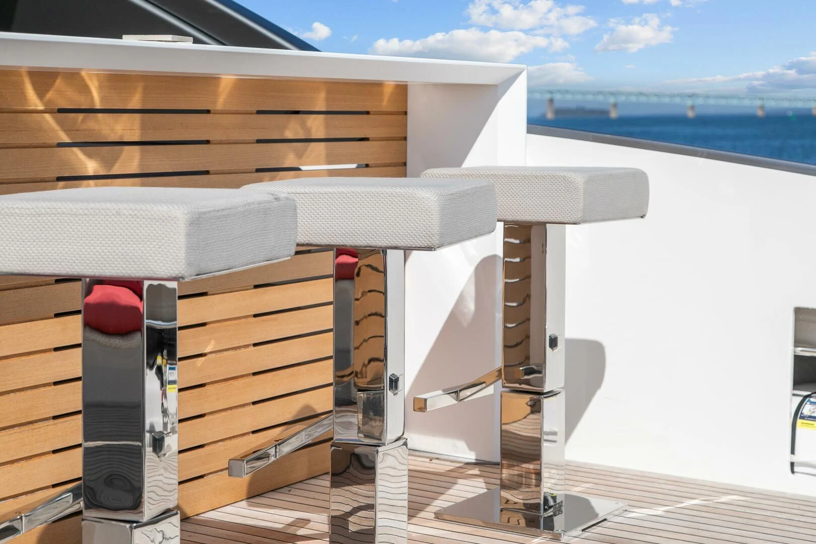 a deck with a deck and a view of the water aboard JUJU Yacht for Sale