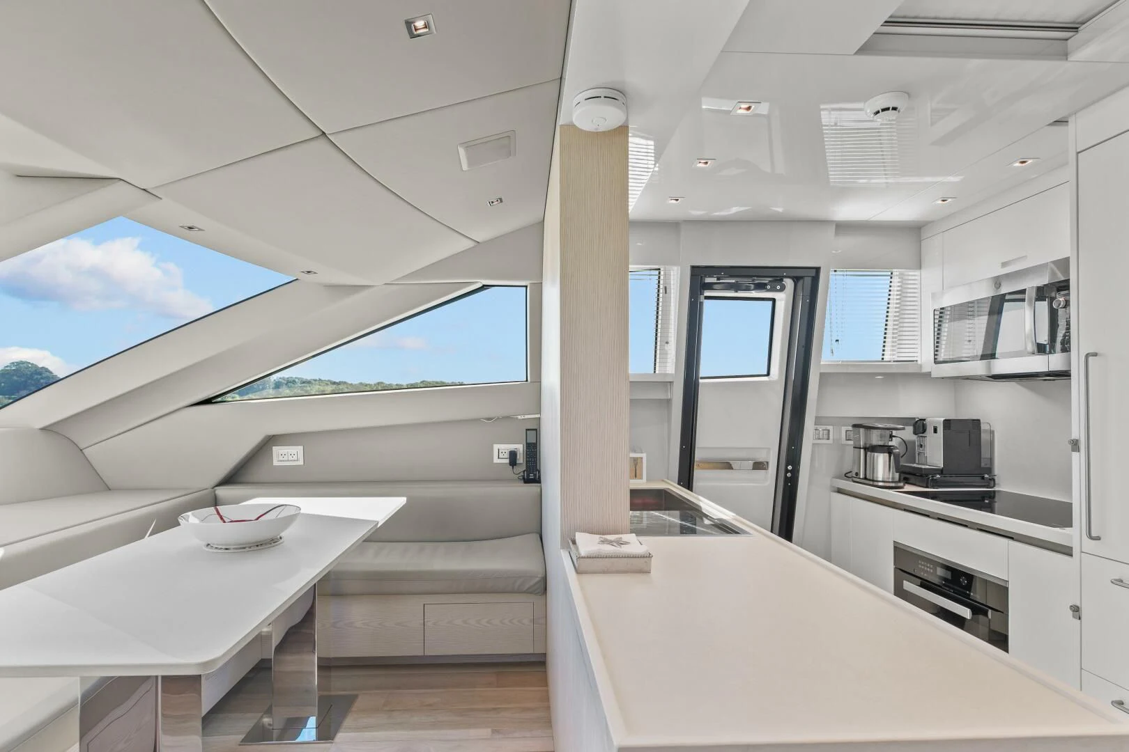 a room with a table and a computer aboard JUJU Yacht for Sale