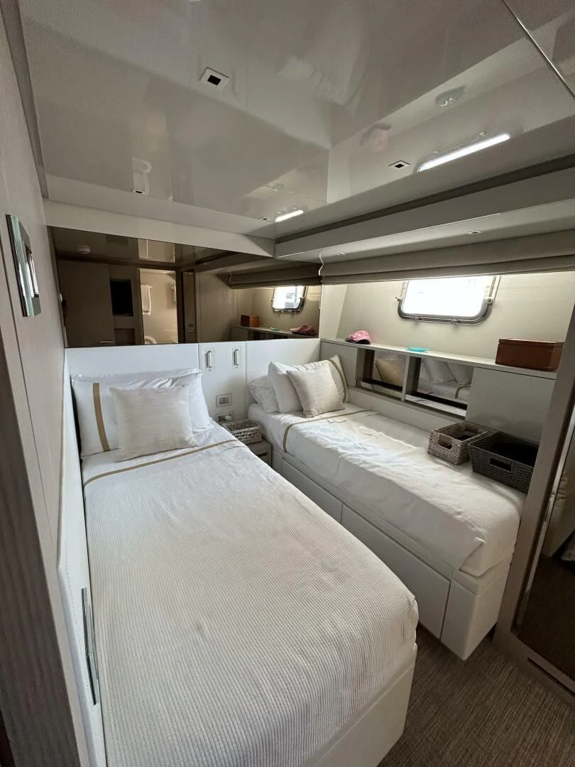 a room with two beds aboard JUJU Yacht for Sale