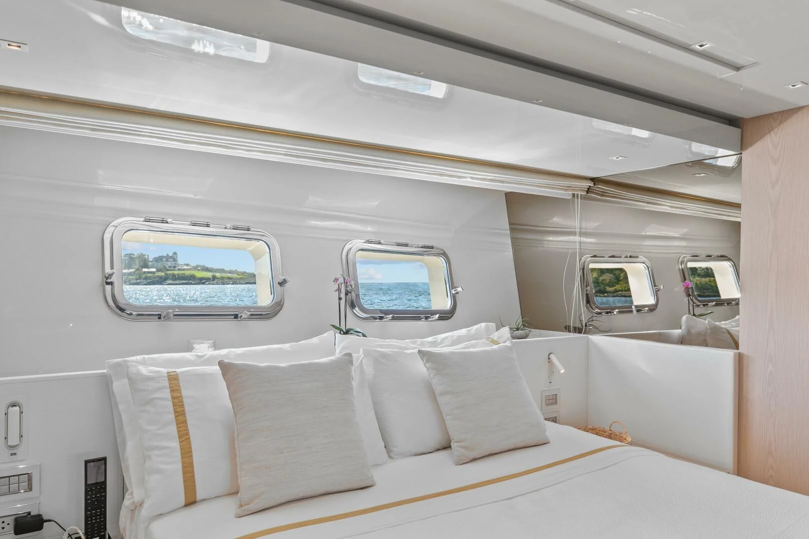 a room with a bed and a window aboard JUJU Yacht for Sale