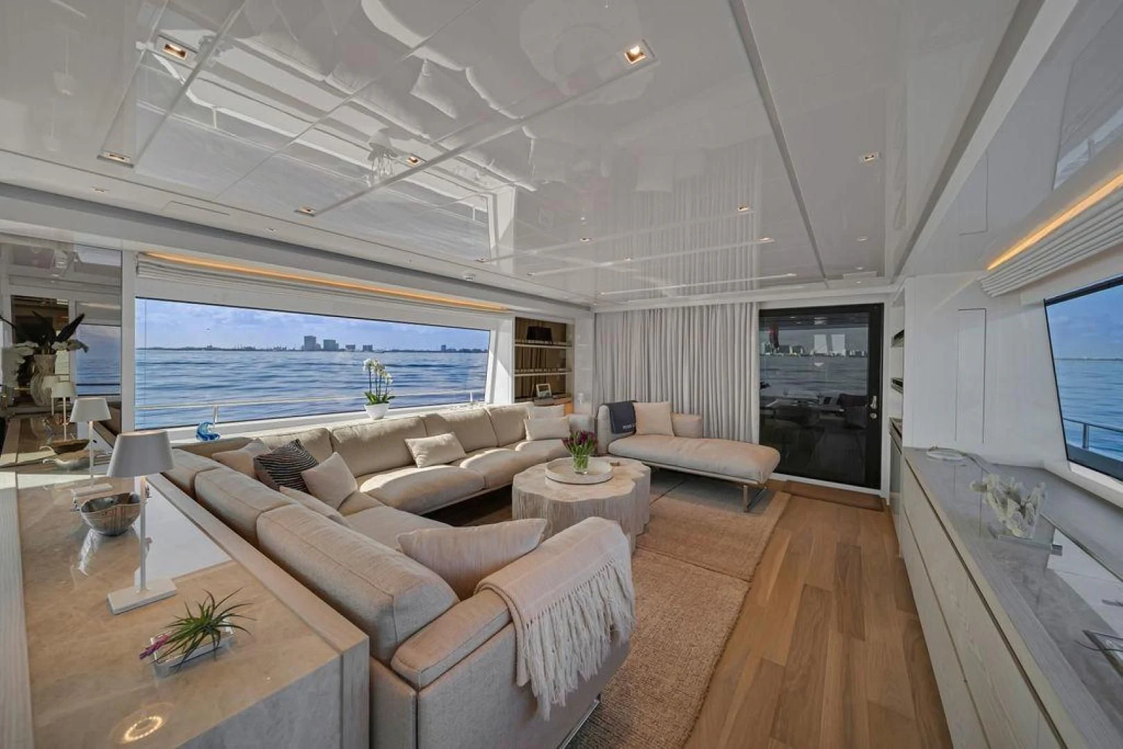 a living room with a large window aboard JUJU Yacht for Sale