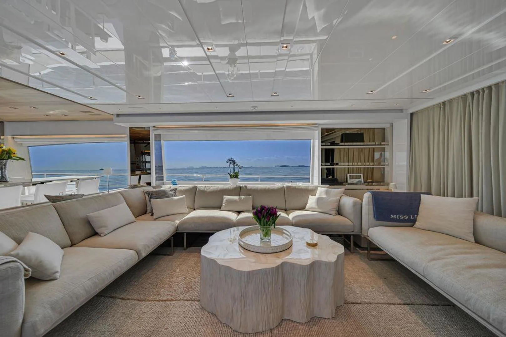 a living room with a large window aboard JUJU Yacht for Sale