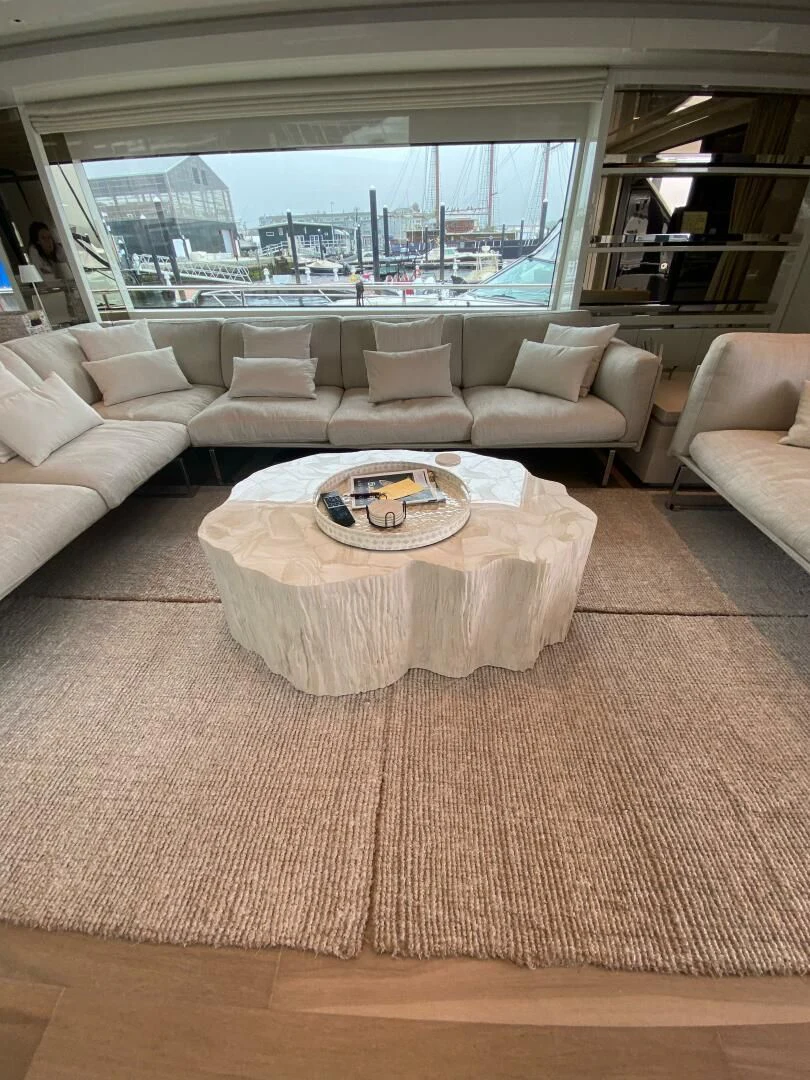 a living room with a large window aboard JUJU Yacht for Sale
