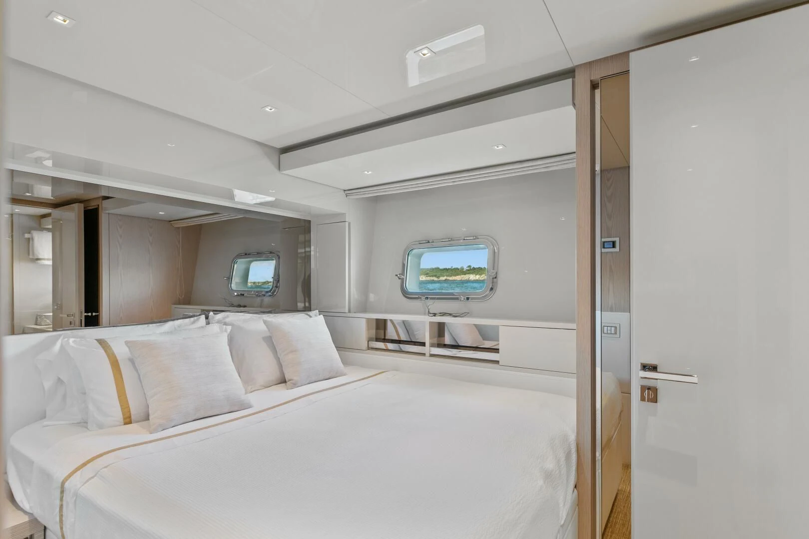 a room with a bed and a window aboard JUJU Yacht for Sale