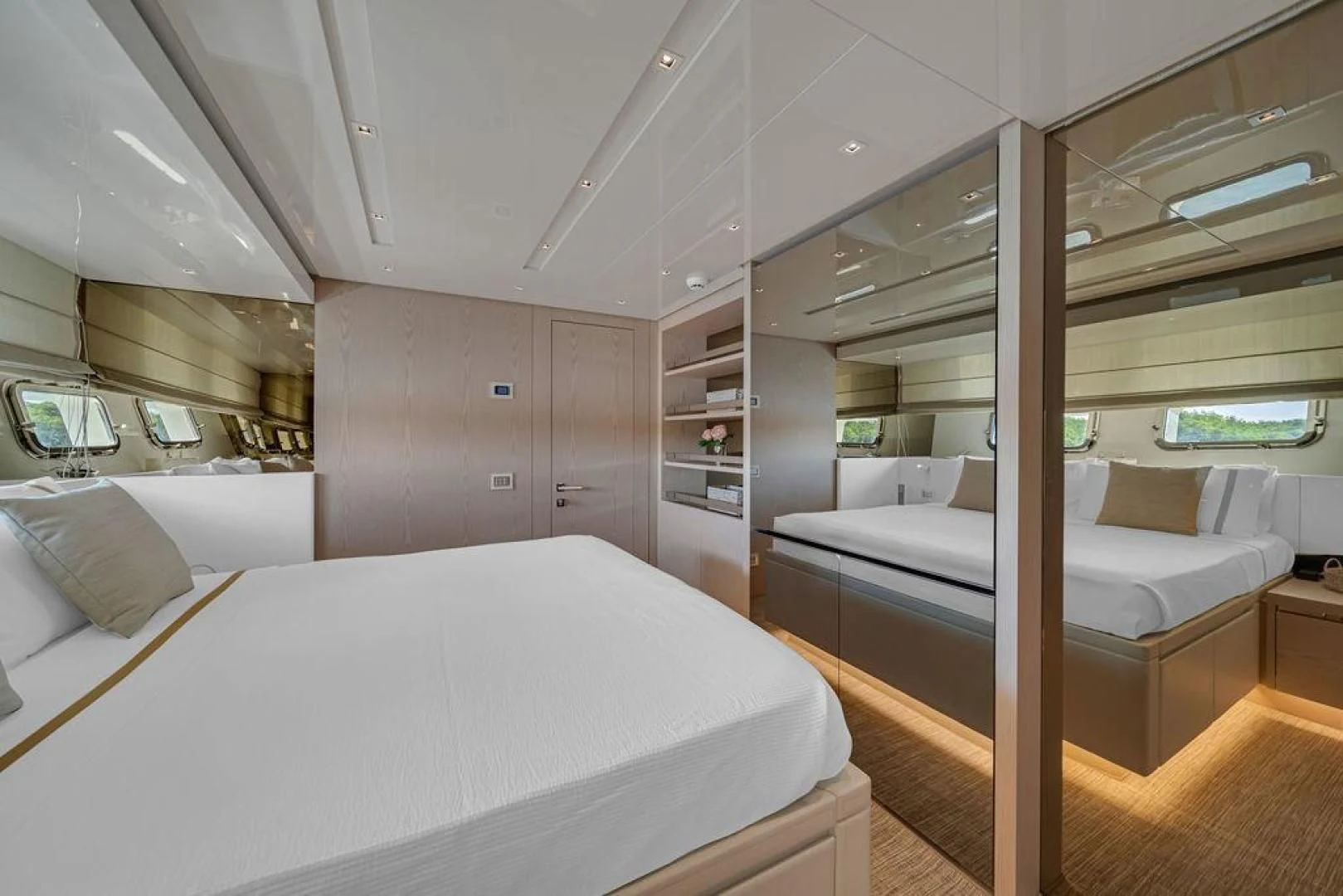 a room with a bed and a couch aboard JUJU Yacht for Sale
