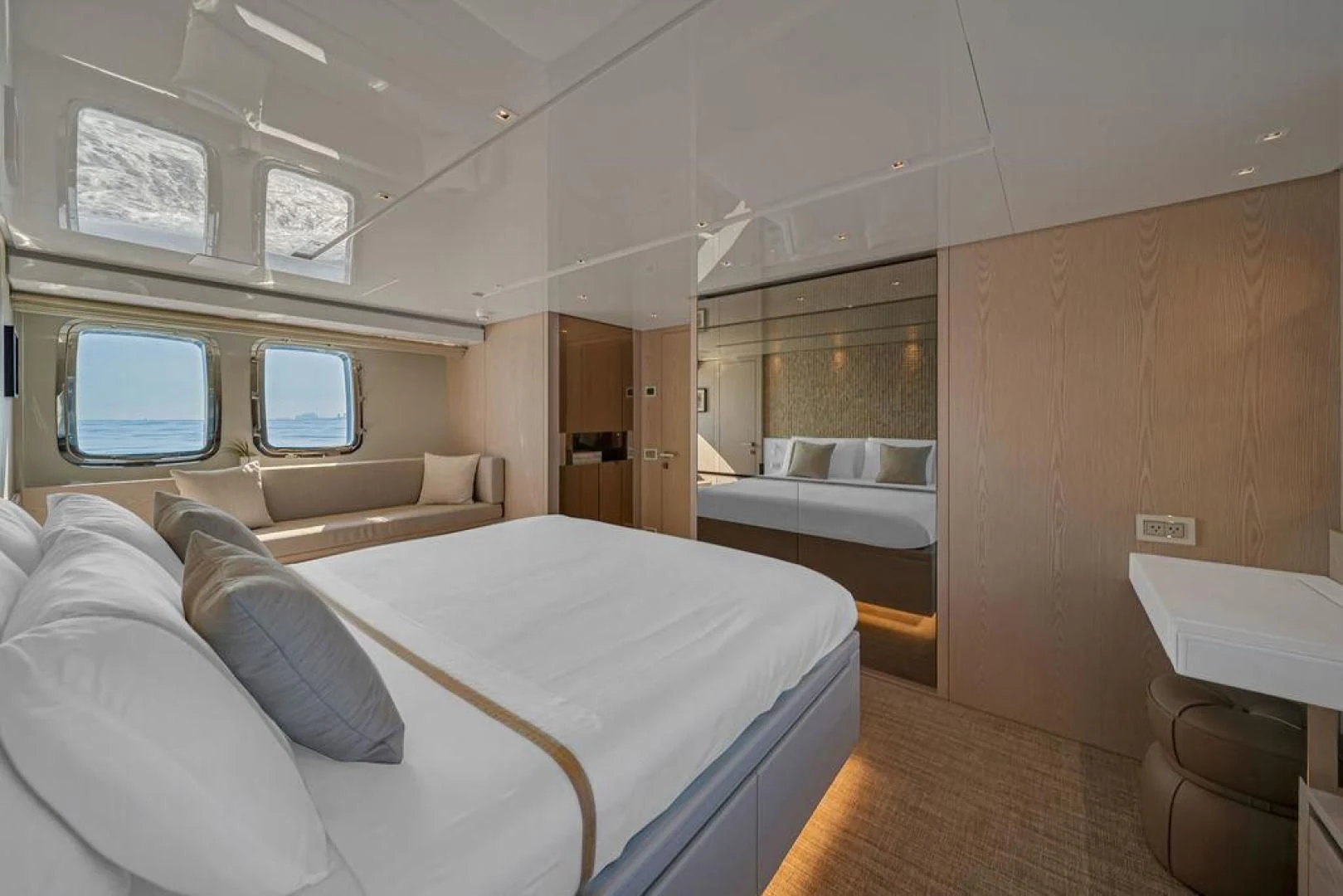 a room with a bed and a couch aboard JUJU Yacht for Sale