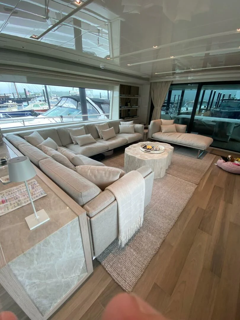 a living room with a large window aboard JUJU Yacht for Sale