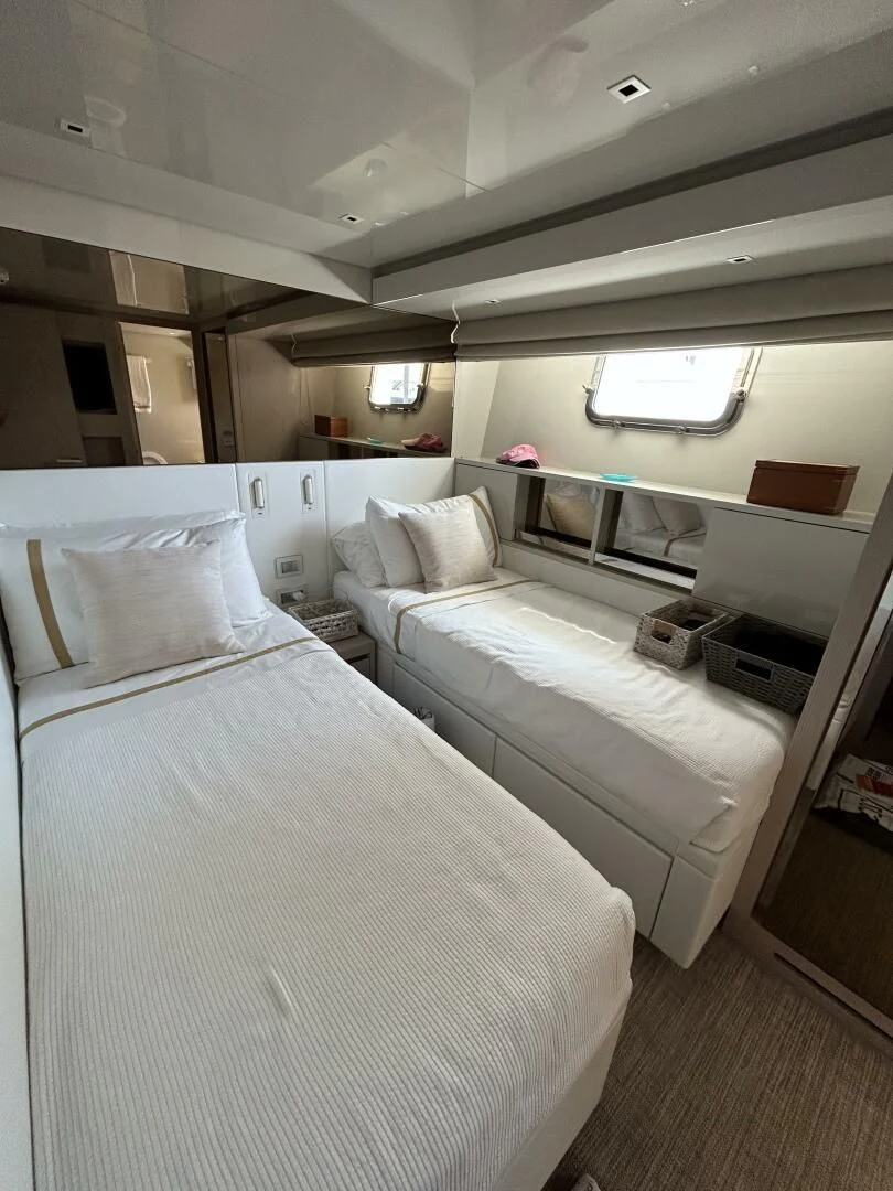 a room with two beds aboard JUJU Yacht for Sale