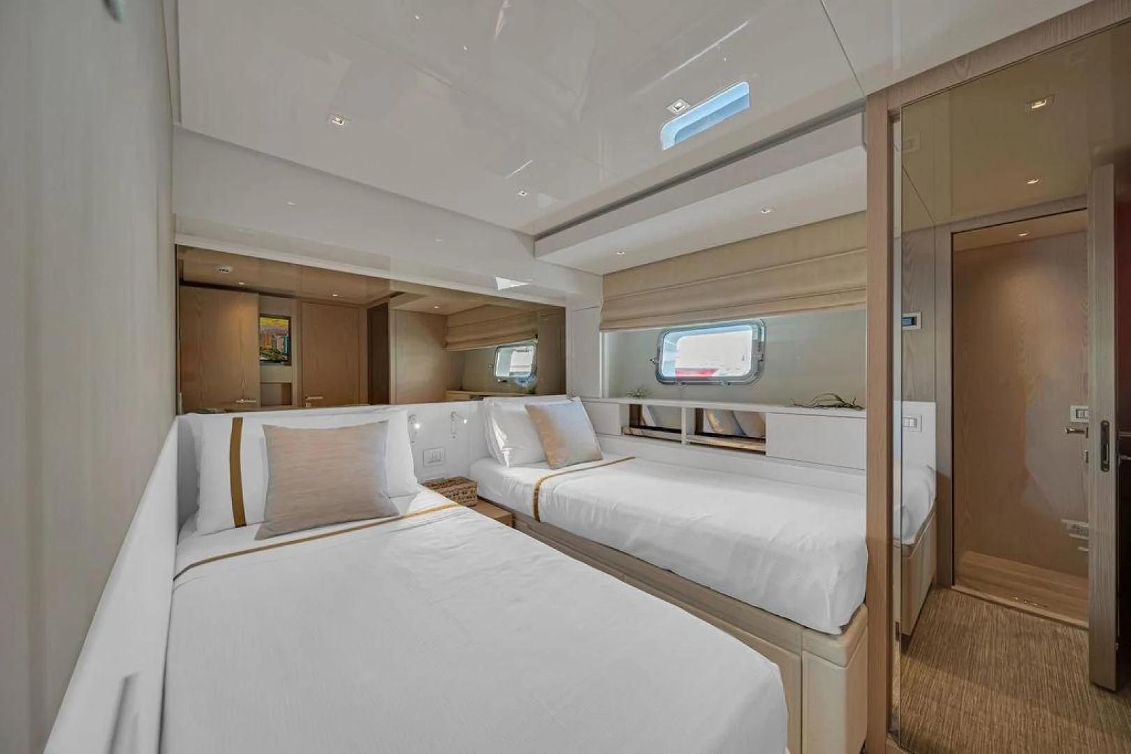 a room with two beds aboard JUJU Yacht for Sale