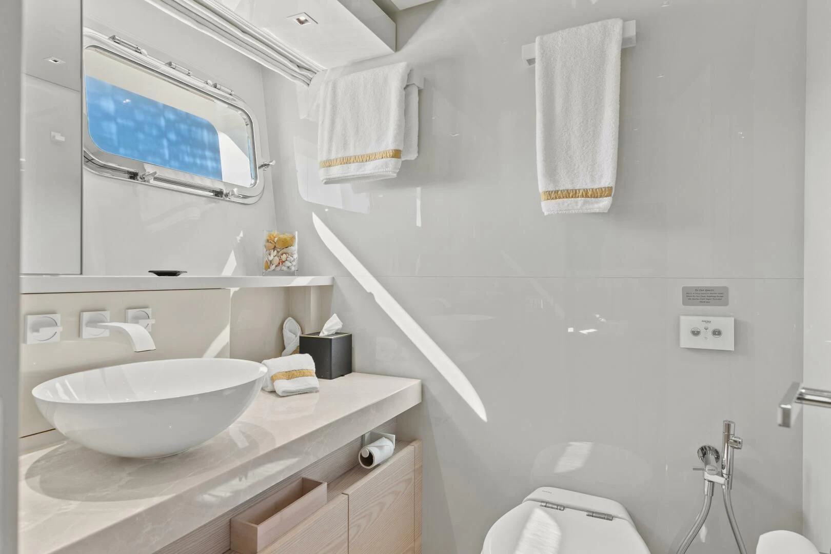 a bathroom with a sink and toilet aboard JUJU Yacht for Sale