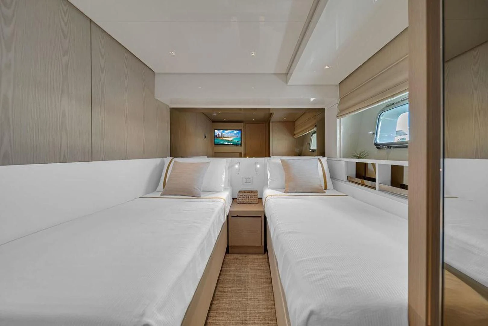 a room with two beds aboard JUJU Yacht for Sale