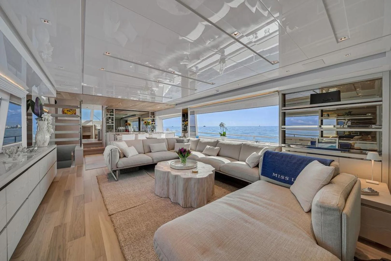 a living room with a large window aboard JUJU Yacht for Sale