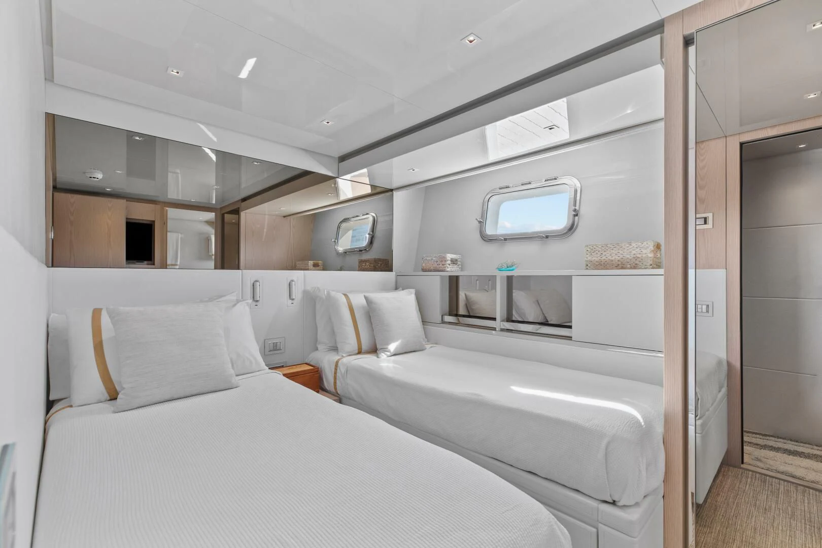 a room with a bed and a window aboard JUJU Yacht for Sale