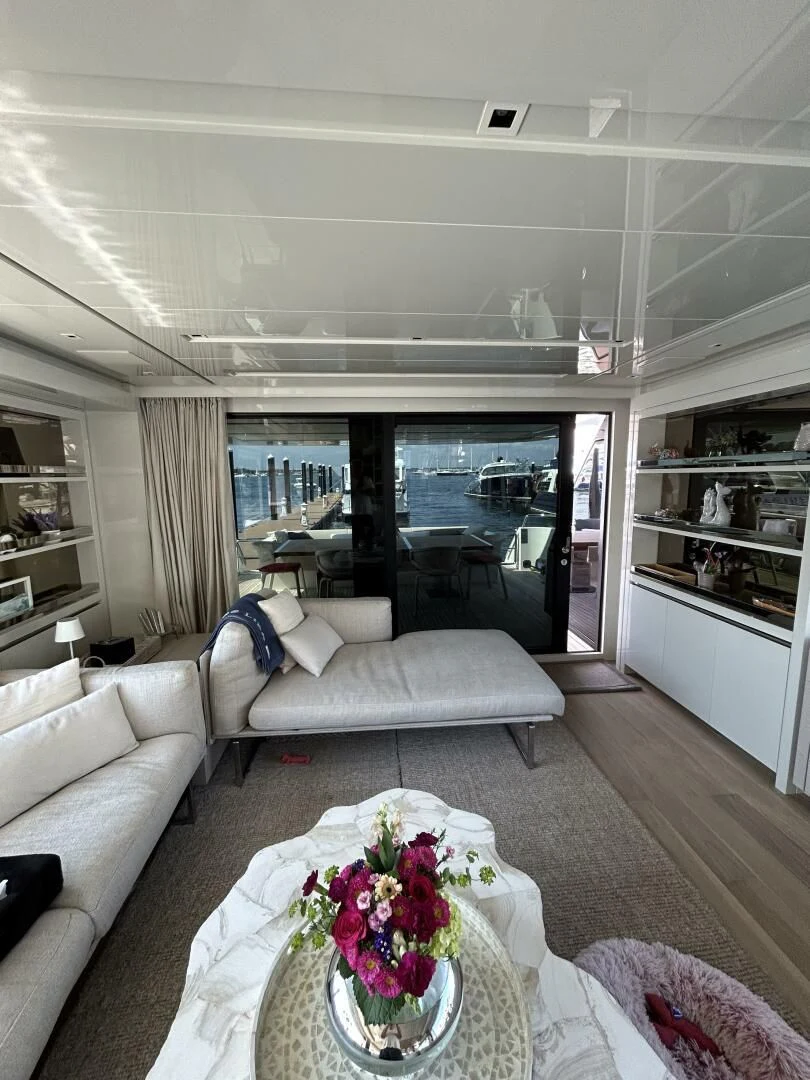 a living room with a large window aboard JUJU Yacht for Sale