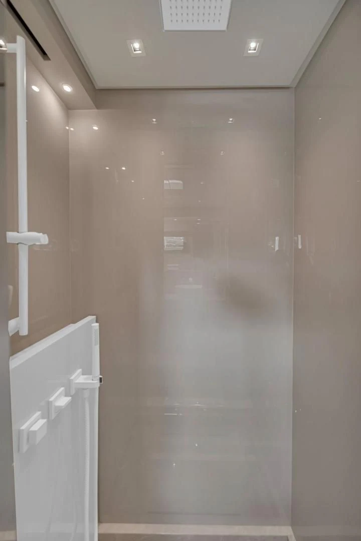 a shower with a glass door aboard JUJU Yacht for Sale