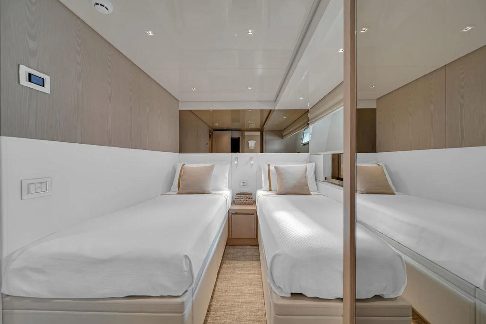 a room with white beds aboard JUJU Yacht for Sale