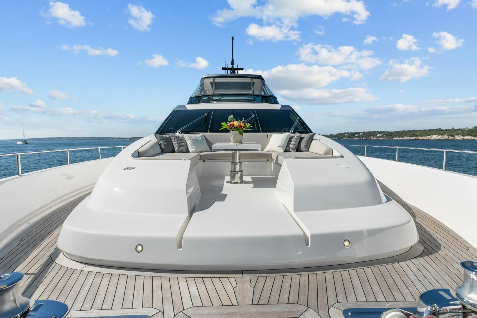 a white boat on a deck aboard JUJU Yacht for Sale