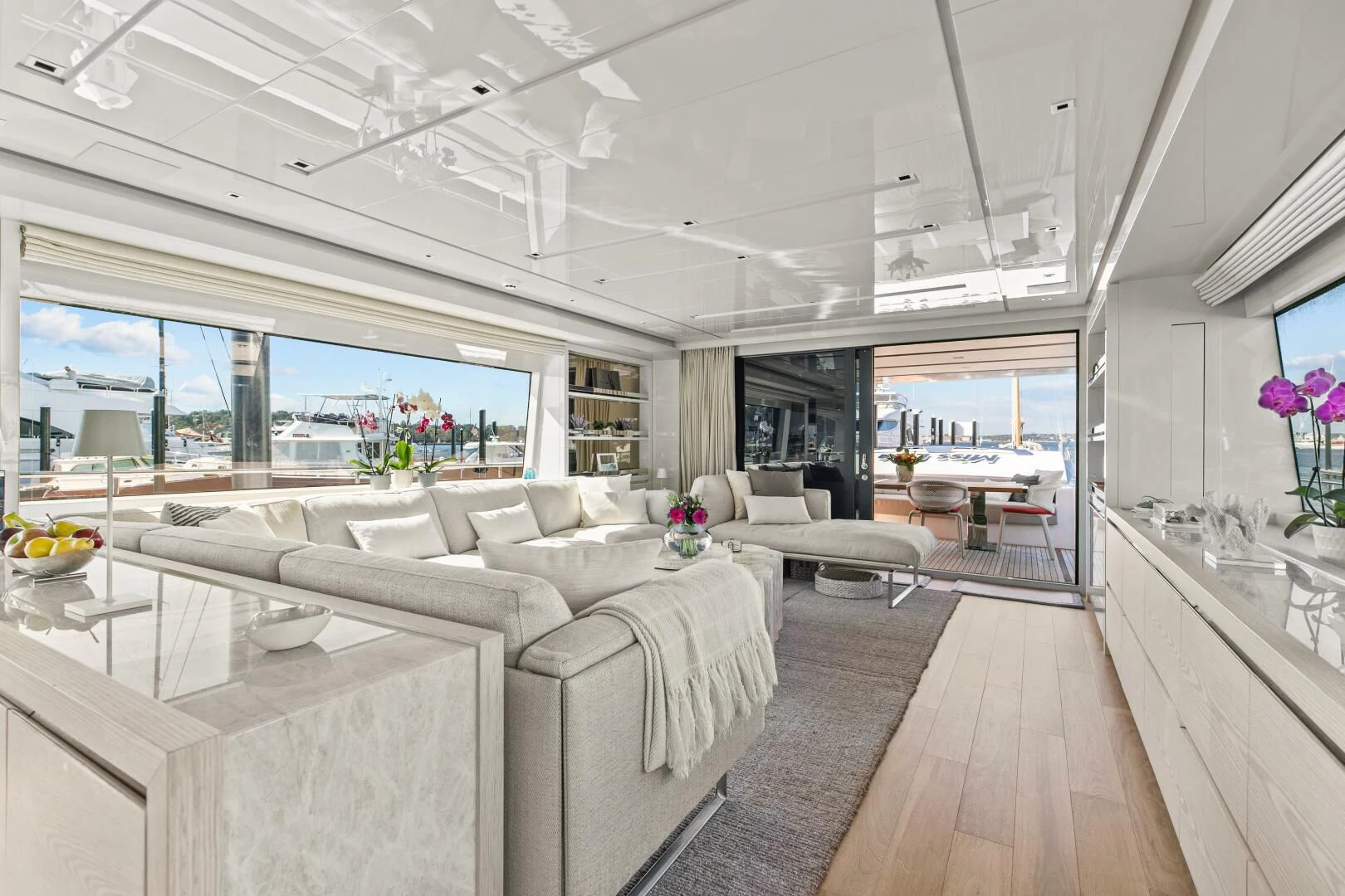 a living room with a large window aboard JUJU Yacht for Sale