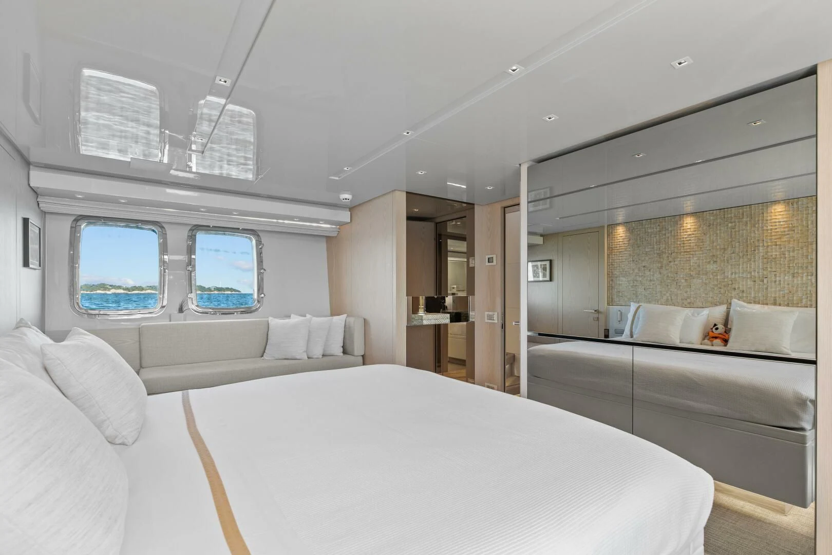 a room with a bed and a window aboard JUJU Yacht for Sale