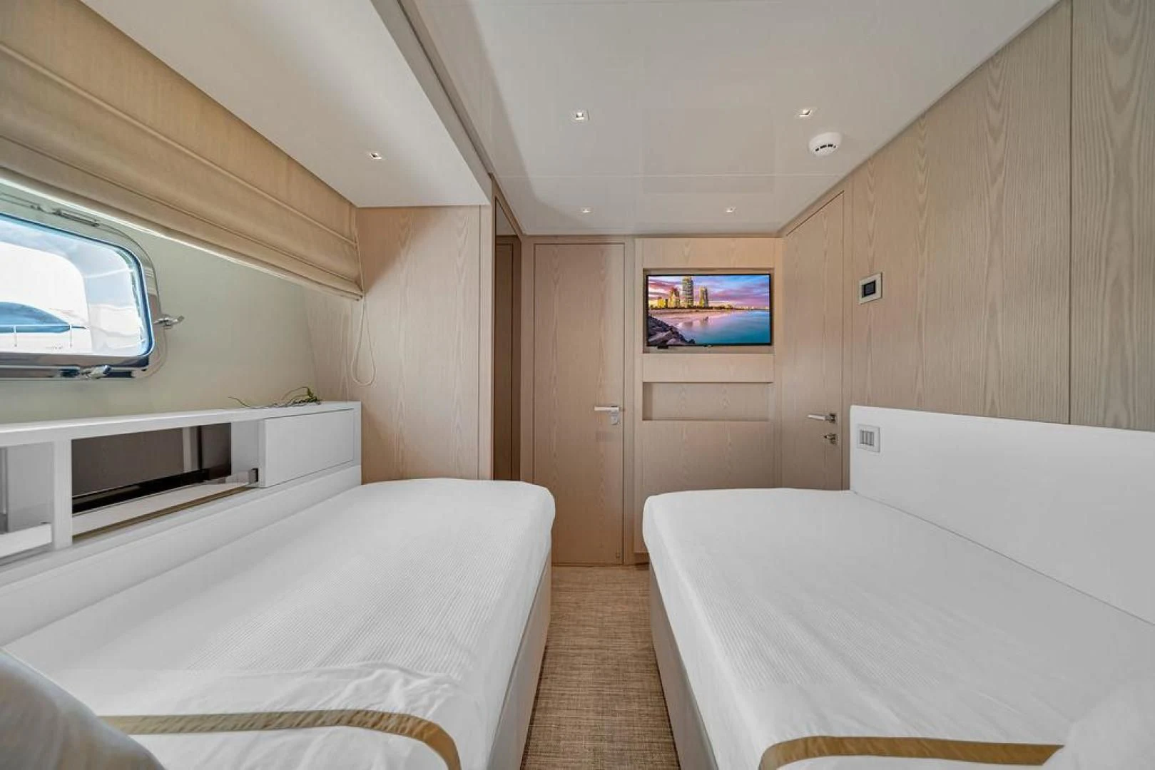 a room with two beds aboard JUJU Yacht for Sale