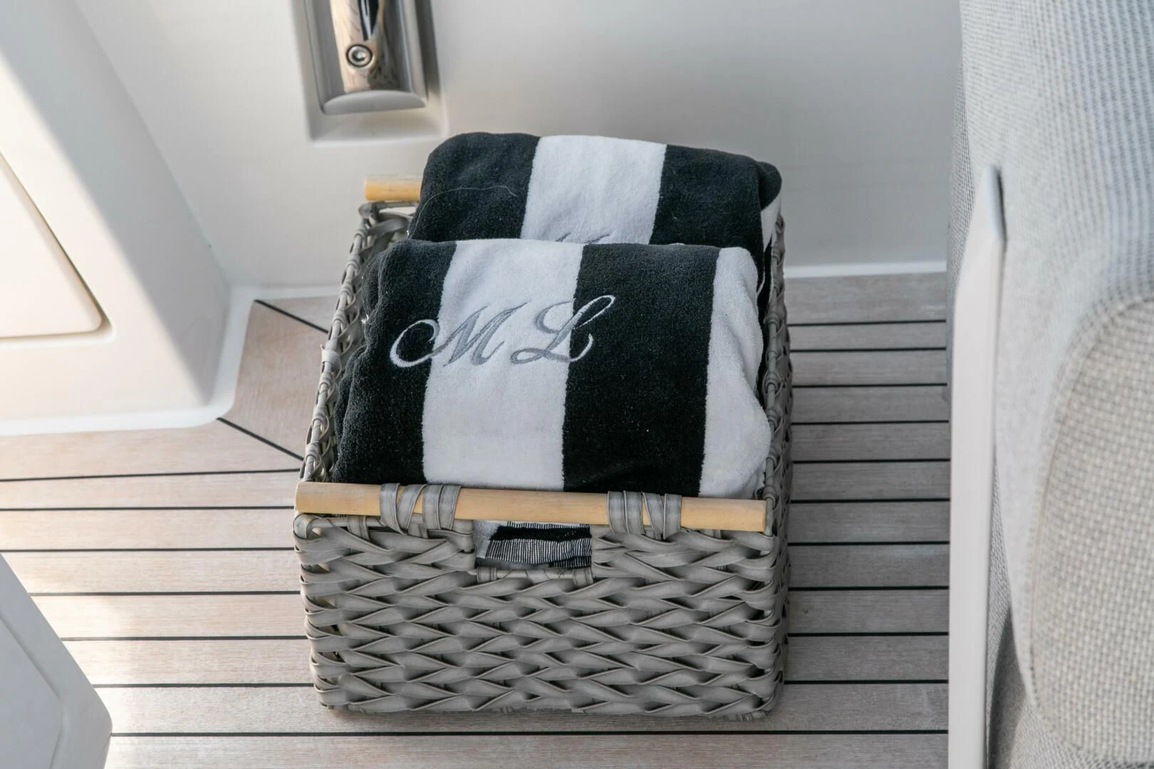 a black and white striped chair aboard JUJU Yacht for Sale