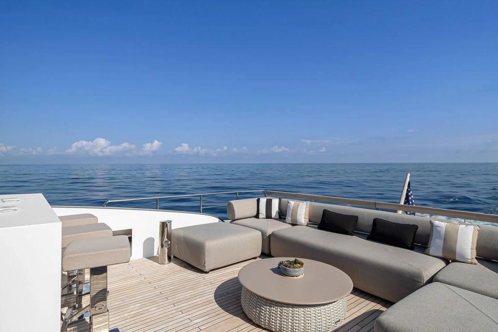 a balcony overlooking a body of water aboard JUJU Yacht for Sale