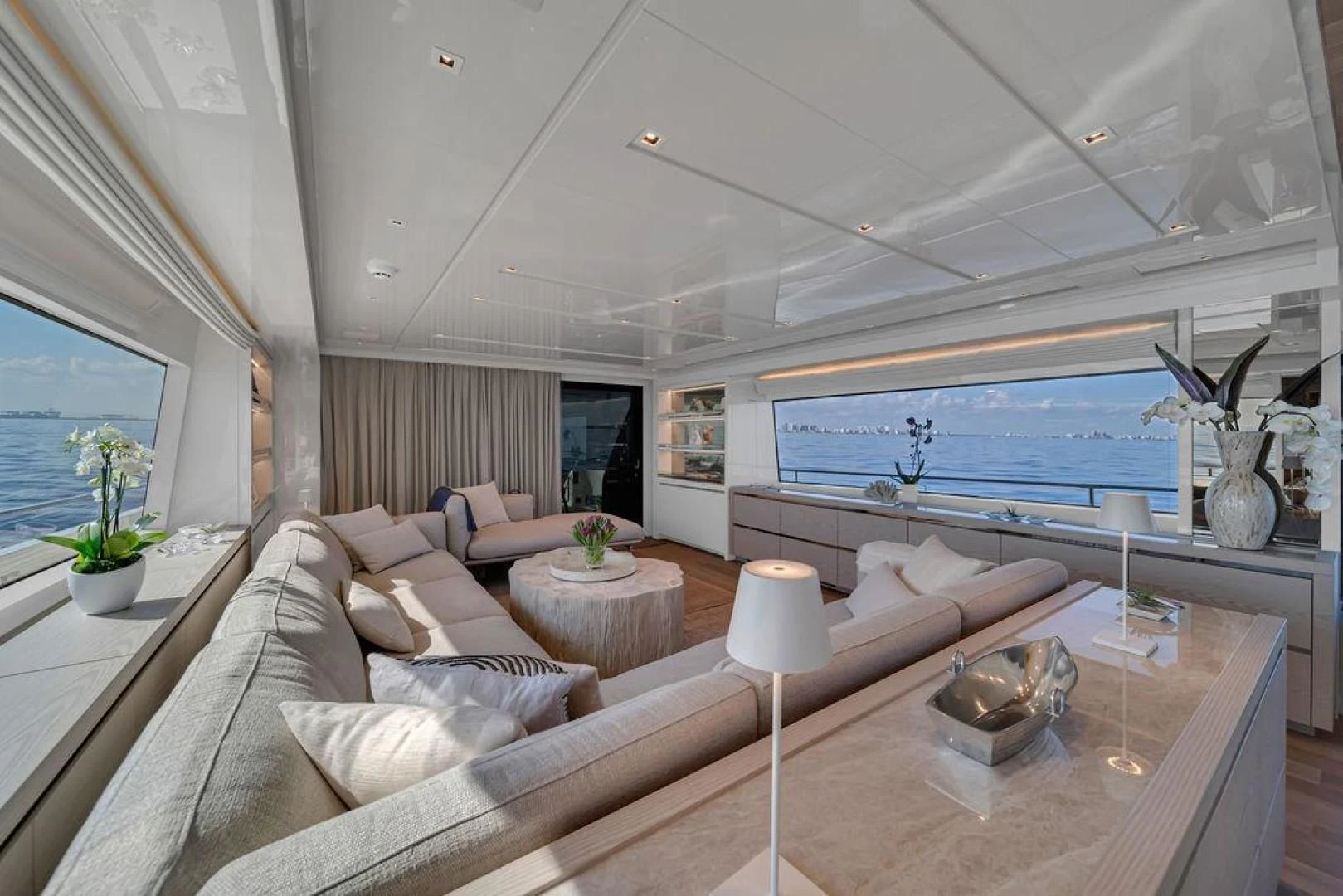 a living room with a large window aboard JUJU Yacht for Sale