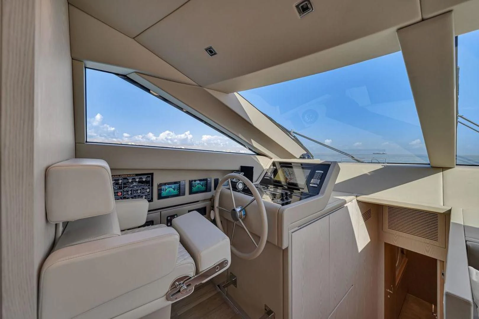 a room with a view of the ocean and the land below aboard JUJU Yacht for Sale