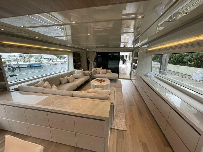 a room with a couch and a table aboard JUJU Yacht for Sale