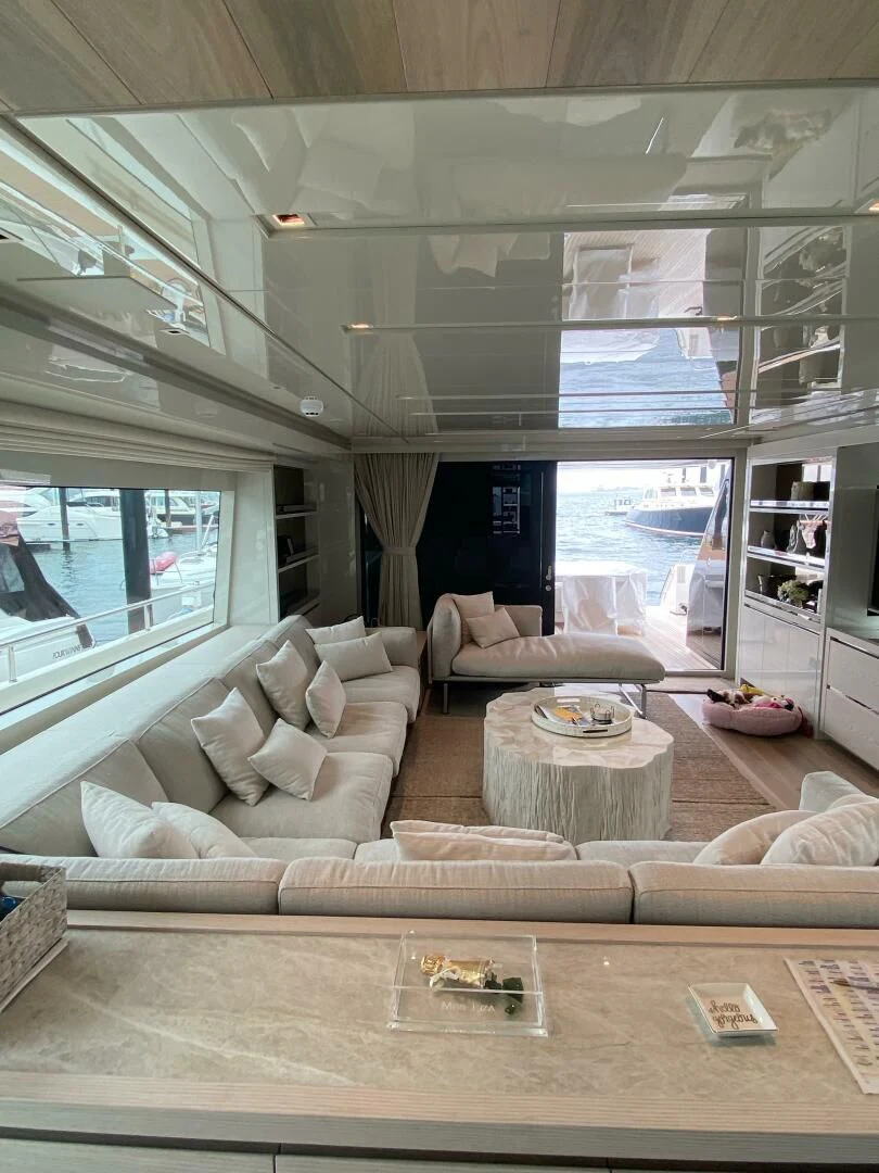 a living room with a large window aboard JUJU Yacht for Sale