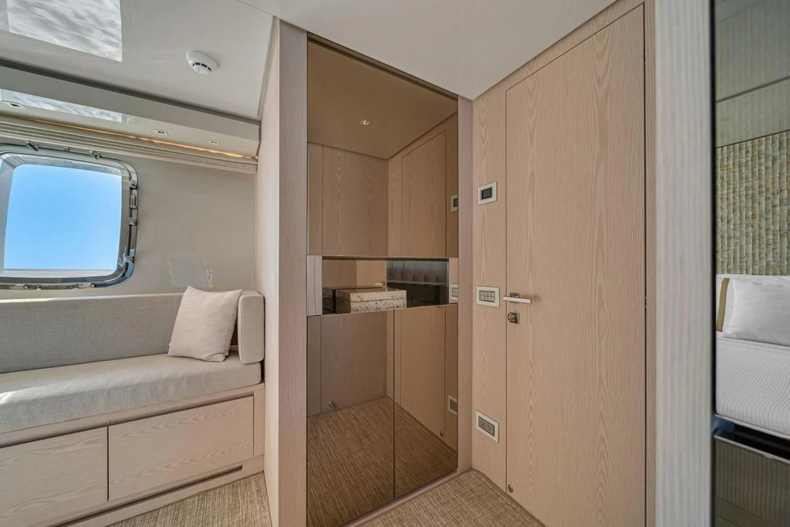 a room with a bed and a window aboard JUJU Yacht for Sale