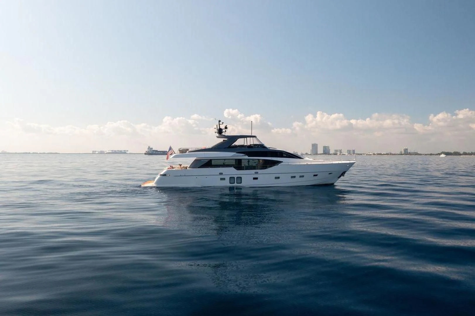 a white boat in the water aboard JUJU Yacht for Sale