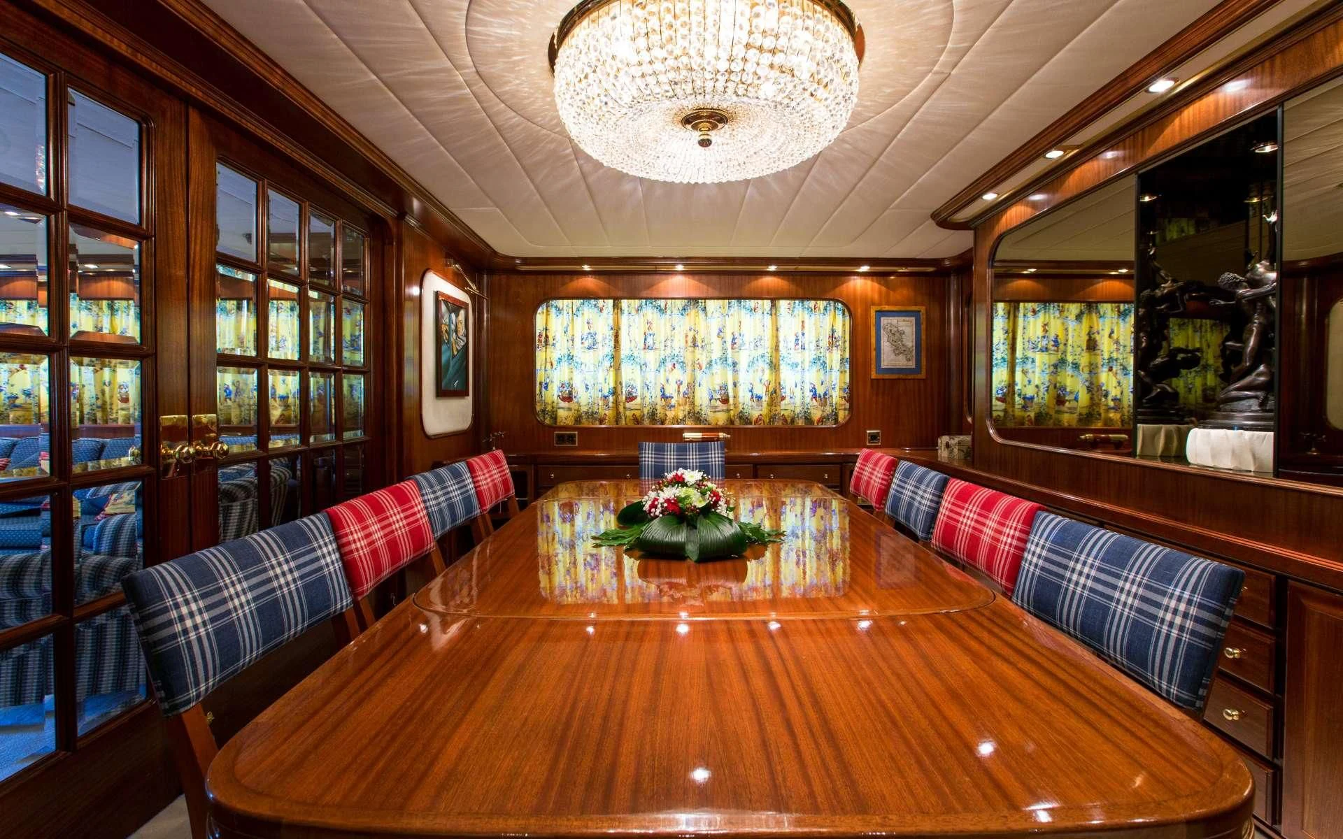 a room with couches and a table aboard STAR OF THE SEA Yacht for Sale