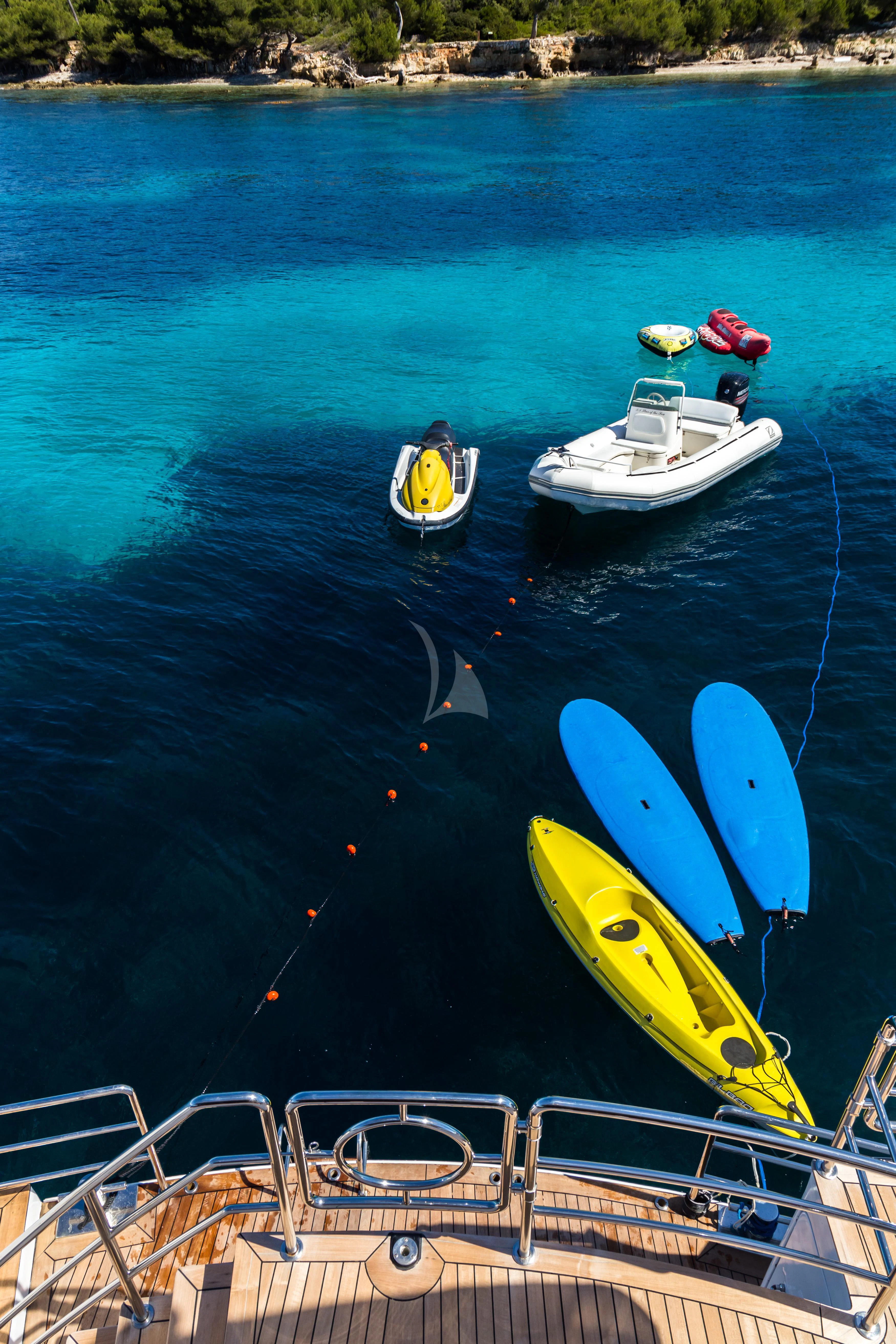 a couple of boats sit on the water aboard STAR OF THE SEA Yacht for Sale