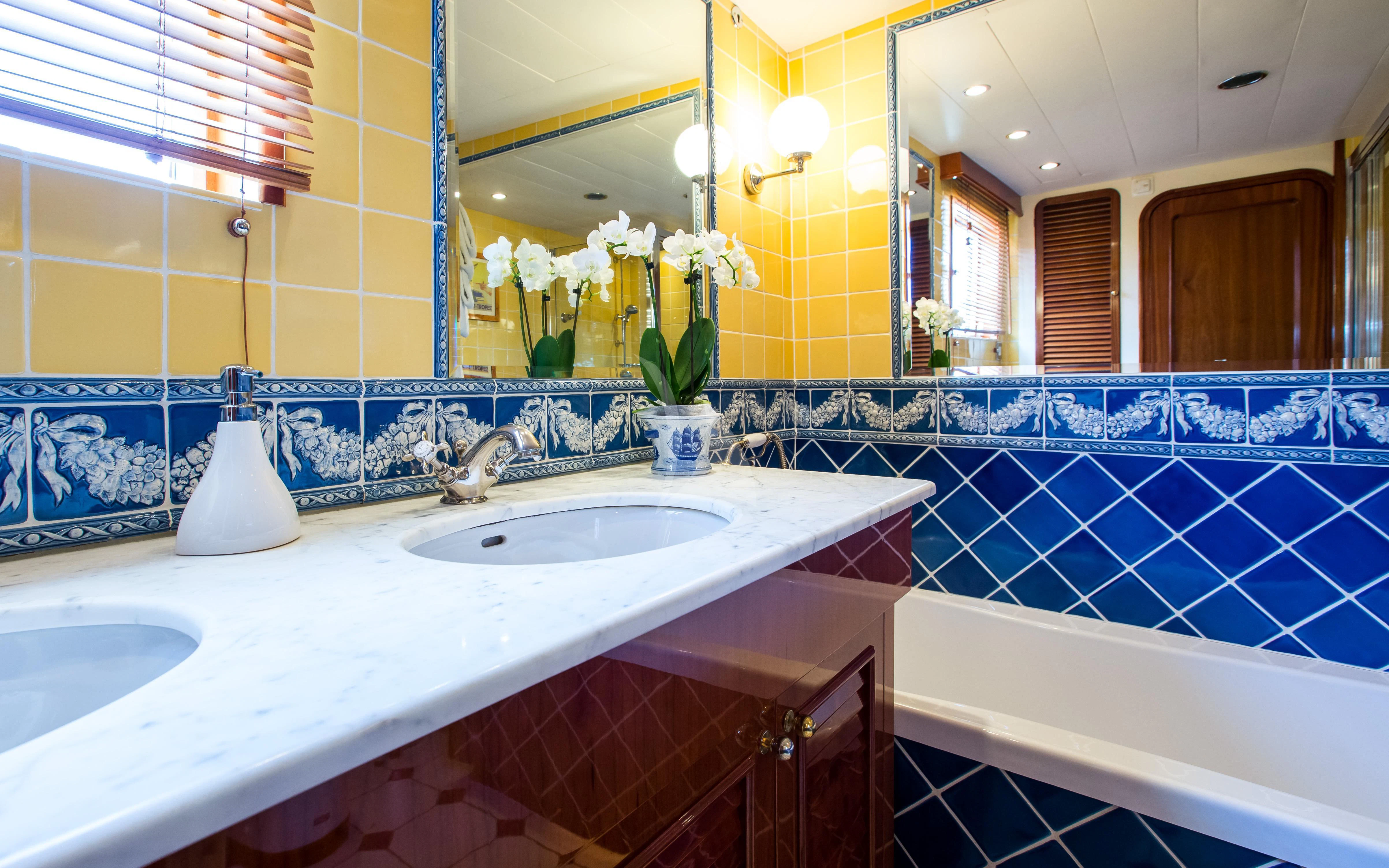 a bathroom with a large mirror aboard STAR OF THE SEA Yacht for Sale